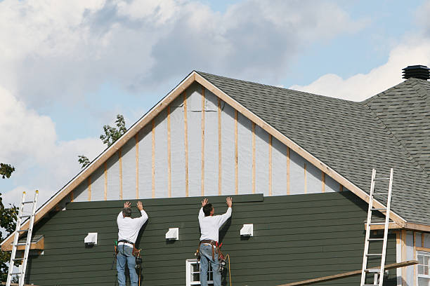 Professional Storm Damage Siding Repair technician working in Strasburg, OH